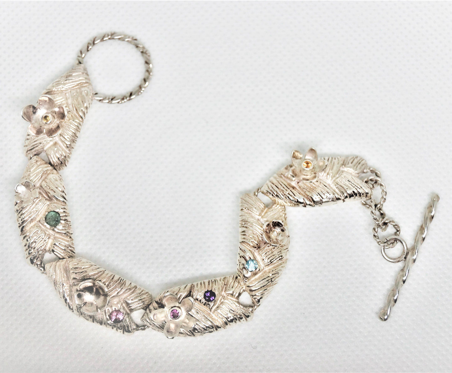 Sterling silver bracelet with flowers and gemstones