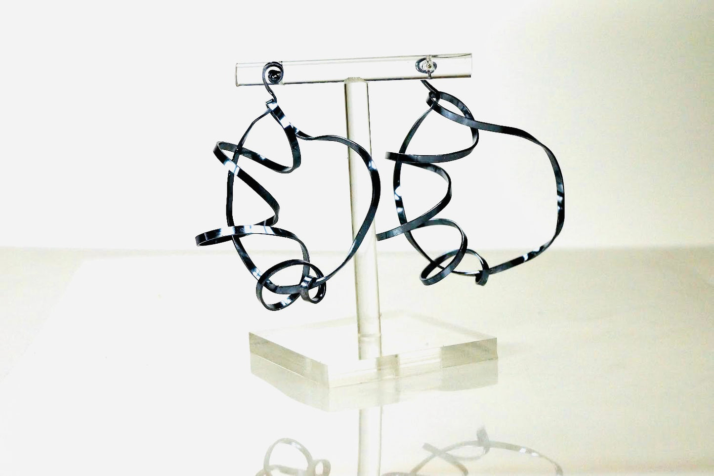 Sterling silver statement hoops ceramic coated in black.