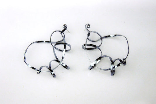 Sterling silver statement hoops ceramic coated in black.